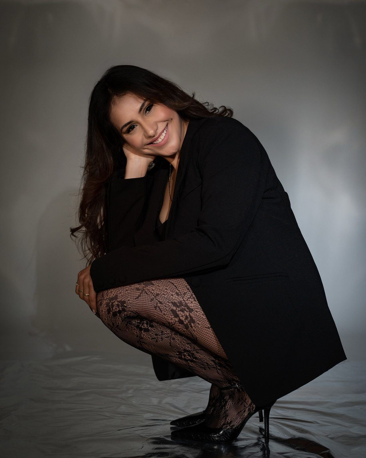 Branding session in a long black coat