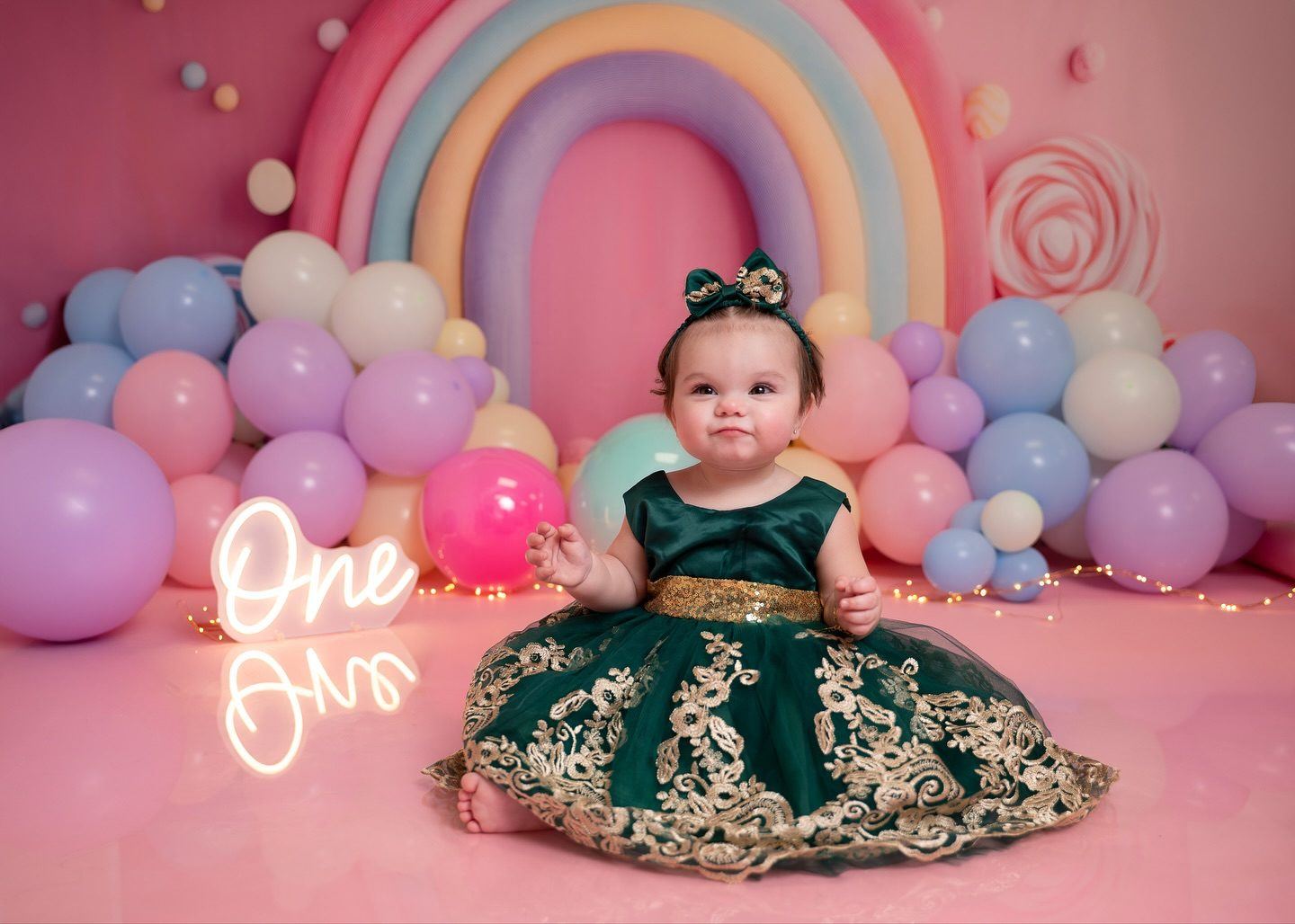 First-birthday rainbow set with a green lace dress
