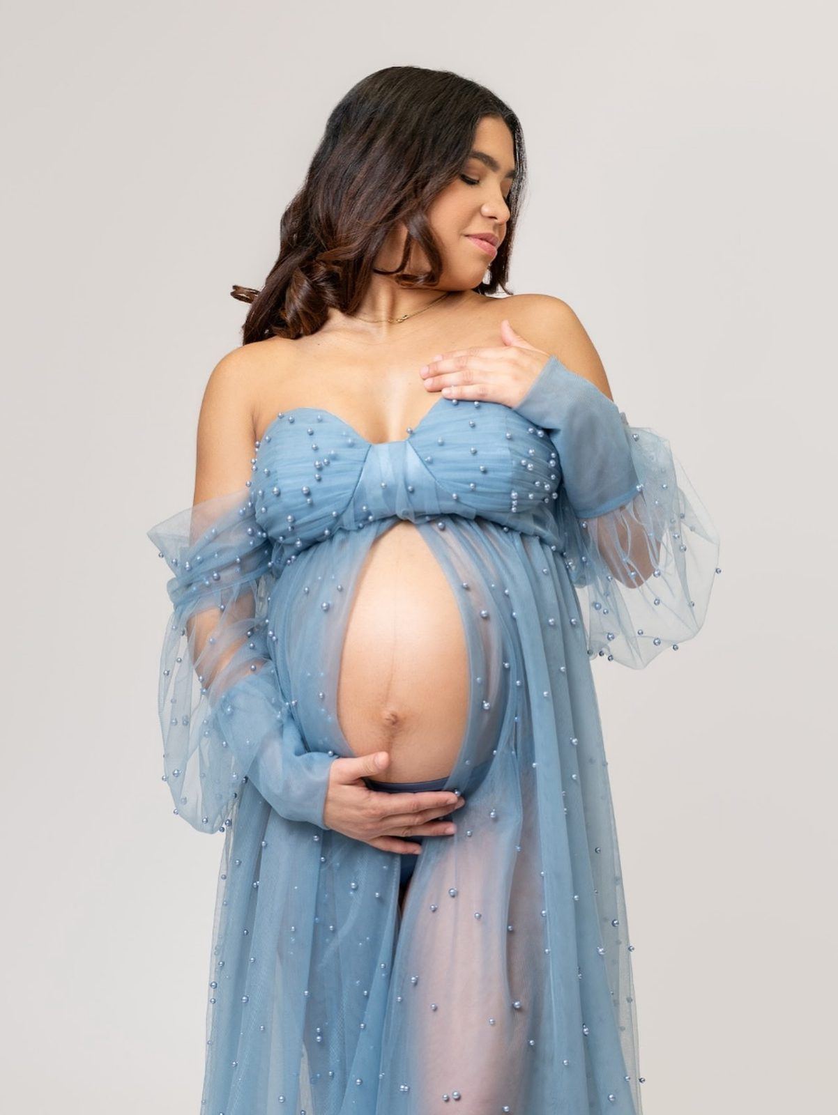 Maternity session in a pearl-studded blue gown