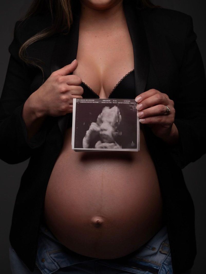 Maternity portrait with a 3D ultrasound print